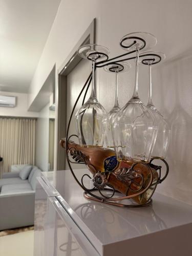 a group of wine glasses sitting on a table at Glamorous SMDC Shore 3, 5 Star Rate BnB-Wifi-Netflix in Manila