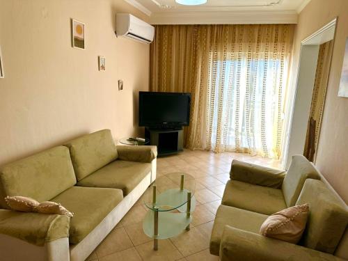 A television and/or entertainment centre at Ammos Apartments