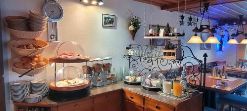 a kitchen with a counter with food on it at Hotel - Pension - Heidelberg inkl. Chiemgaukarte in Ruhpolding