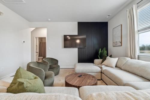 a living room with a couch and chairs and a table at Luxury 5BR Home Minutes from Wilmington Beaches in Scotts Hill