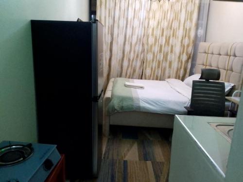 a small bedroom with a small bed and a window at Harmony Haven in Rungiri