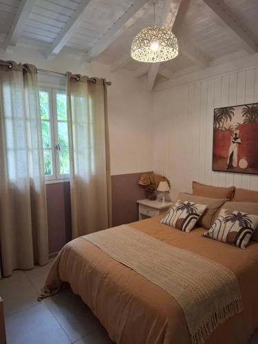 Postel nebo postele na pokoji v ubytování VILLA ZEN