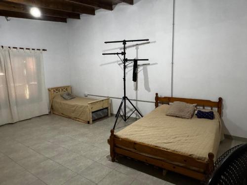a room with two beds and a telescope in it at No alquilar in Cucullú