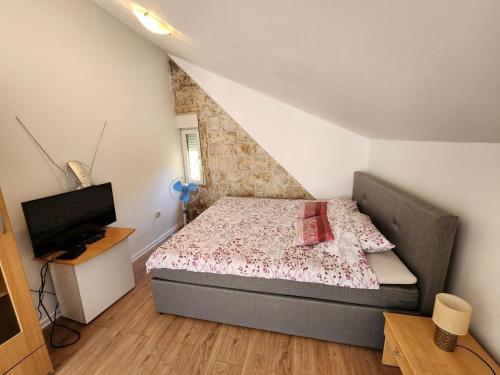 Postel nebo postele na pokoji v ubytování Apartmani Sole