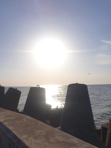 a view of the ocean from a pier at Pokoje Sandra I in Łeba