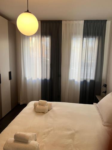 Postel nebo postele na pokoji v ubytování Cremona Inn Aparthotel