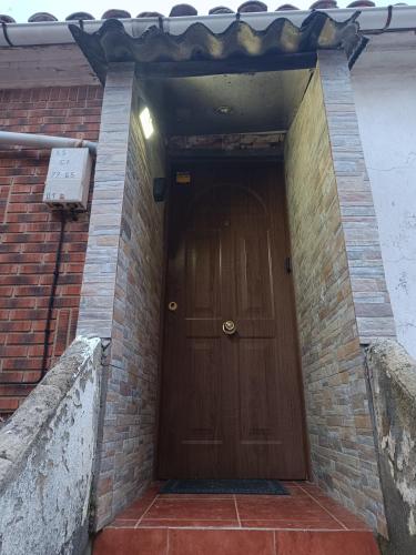 a brown door in a brick building at Sol River in Guardo