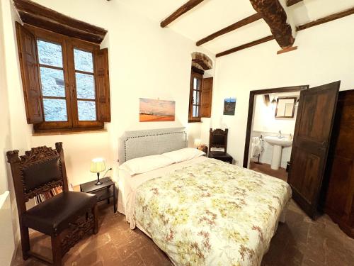 Posteľ alebo postele v izbe v ubytovaní Appartamenti a Pitigliano