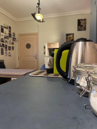 a tea kettle sitting on a counter in a kitchen at CRAFT LOFT - Amber 232 in Jeddah