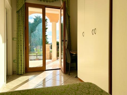 Postel nebo postele na pokoji v ubytování Hotel Costa Doro - Caffè