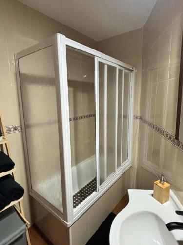 a bathroom with a shower and a toilet and a sink at Casa Azacanes in Sanlúcar de Barrameda