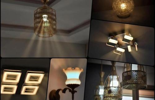 a room with several lights and lamps on the wall at 2 minutes de la plage , Résidence Tamourrit, Taghazout Bay , vue mer , golf , piscine in Taghazout