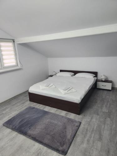 Postel nebo postele na pokoji v ubytování Casa Lupeni