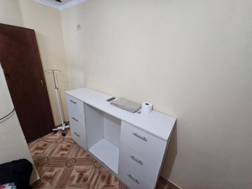 a white desk with a keyboard on top of it at HOSPEDAJE ALVARADO - Matrimonial - 103 - Bueno Bonito y Barato in Cajamarca