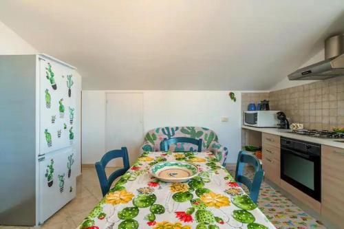 a kitchen with a table with a plate on it at A Ficu Pala in Siracusa