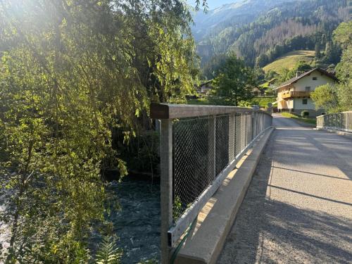 a bridge over a road with a mountain at Ferienwohnung Die Möll in Latzendorf