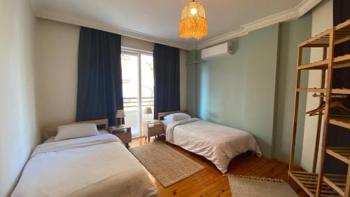 Ένα ή περισσότερα κρεβάτια σε δωμάτιο στο Alanya merkezde denize 100mt 2+1