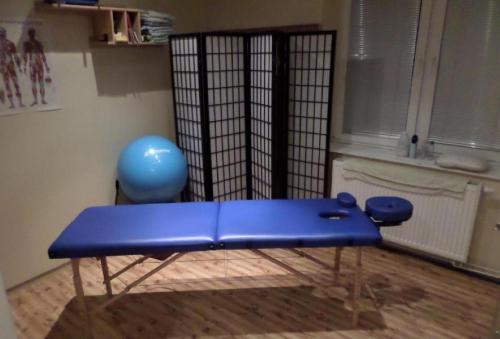 a blue bench in the corner of a room at Privat Bohemia in Šatov