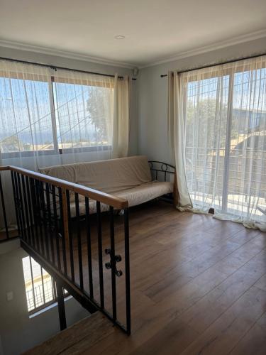 Una cama o camas en una habitación de Casa en el Tabo