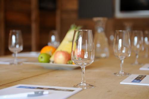 a group of wine glasses sitting on a table at Alpinhotel Bort in Grindelwald