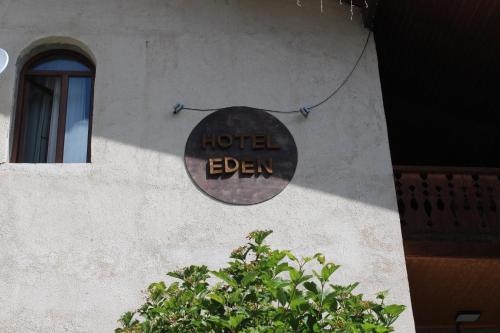 a sign that says hotel eden on the side of a building at Hotel Eden in Mestia