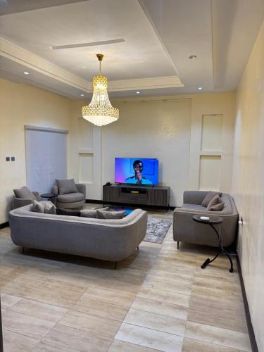 Televiisor ja/või meelelahutuskeskus majutusasutuses Urban Oasis 2 BEDROOM
