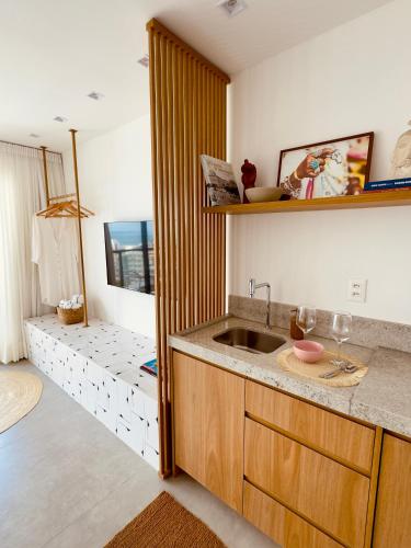 a kitchen with a sink and a counter at IorubaStudio in Salvador