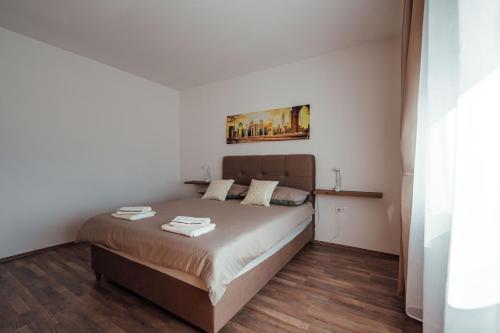 Postel nebo postele na pokoji v ubytování Apartman Mario