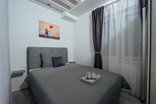 Postel nebo postele na pokoji v ubytování Apartman Mario