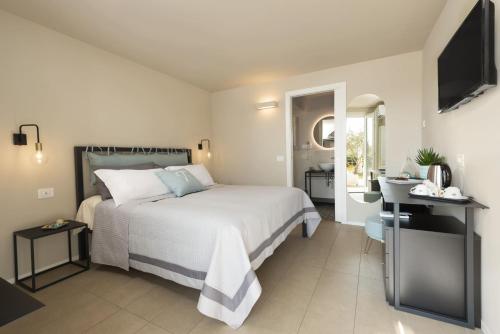 Ένα ή περισσότερα κρεβάτια σε δωμάτιο στο Camere Relais Filomare