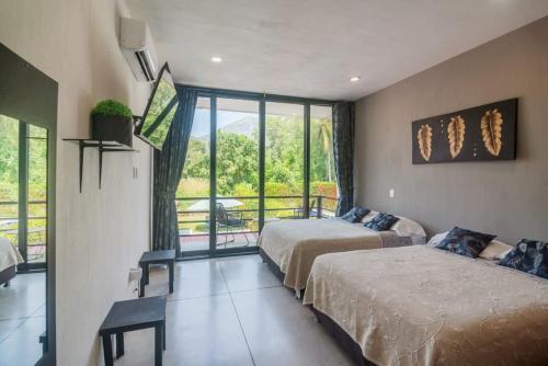 Katil atau katil-katil dalam bilik di Celina beach house en Manzanillo