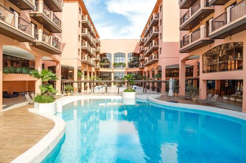 Swimmingpoolen hos eller tæt på Jurerê - Hotel - Studio em Beach Village - Florianópolis