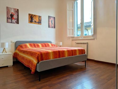 Ένα ή περισσότερα κρεβάτια σε δωμάτιο στο Tuscany Home Montecatini Centro