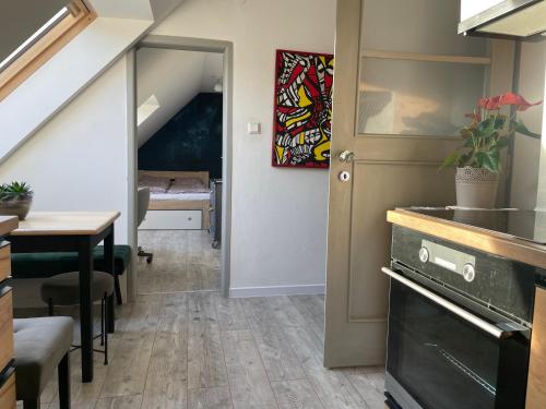 a room with a staircase and a table and a door at Apartmán Kubín in Dolný Kubín