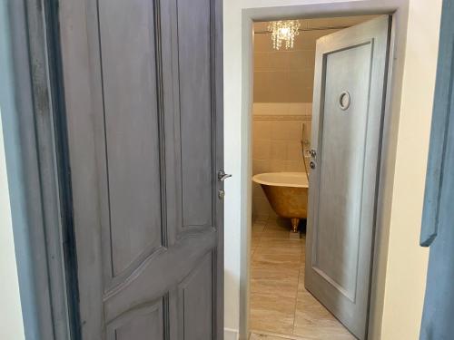 an open door to a bathroom with a sink at Apartmán Kubín in Dolný Kubín