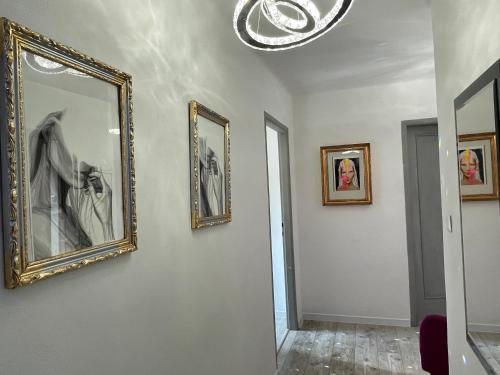 a room with three pictures on the wall at Apartmán Kubín in Dolný Kubín