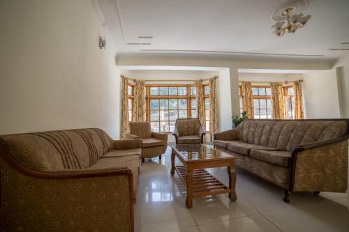Posezení v ubytování Hotel Satkar Residency - Riverside Old Manali