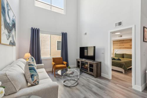 a living room with a couch and a tv and a bed at Stay at Luna on 800 Callowhill in Philadelphia