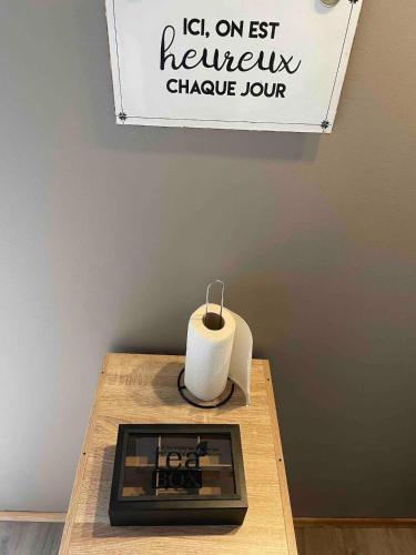 a stove on a wooden table with a candle on it at Chez colette in Commes