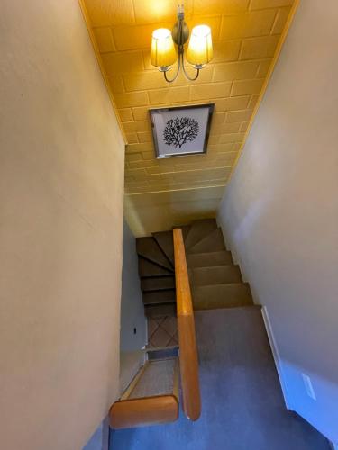 a staircase with a bench and a picture on the wall at Hostal Brisa Serena in Santiago