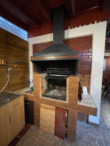 a kitchen with a large stove in a room at Hostal Brisa Serena in Santiago