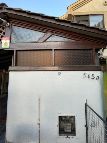 a large white garage with a window on it at Hostal Brisa Serena in Santiago