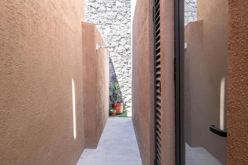 an open door to a hallway in a building at Olivia's home in Zibata Queretaro in La Cañada