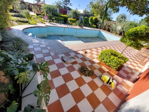 an overhead view of a pool with a checkered floor at Quinta Rubi in Las Rosas