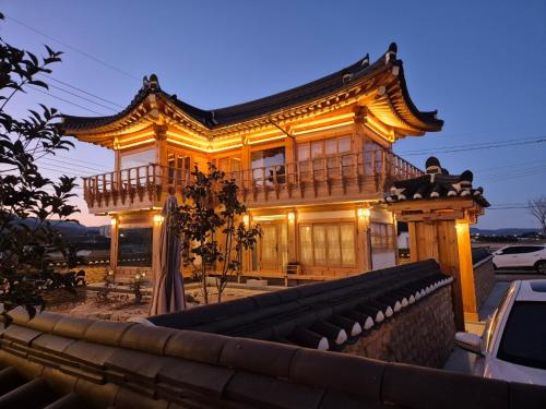 a building with a japanese style building at Hanok Stay Seowa in Gyeongju