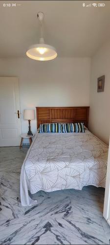 a bedroom with a large bed with a ceiling at Manilva Beach 140 in Manilva