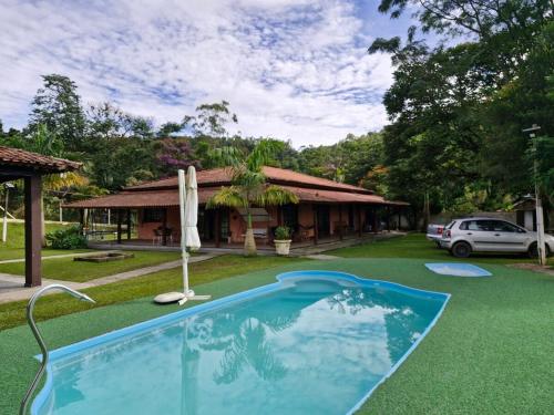 Swimmingpoolen hos eller tæt på Chácara Bons Companheiros