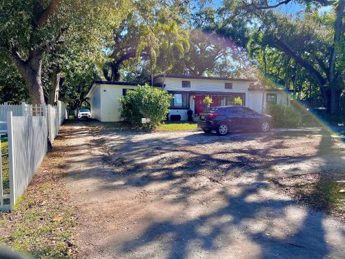 a car parked in front of a house at The Boutique Guest House in Miami