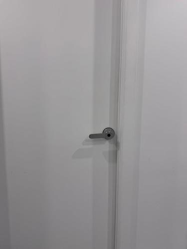a door with a door knob on a white wall at Private Bedroom with Dedicated Bathroom 15mis NYC in West New York