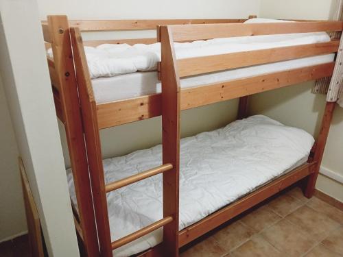 two sets of bunk beds in a room at Apartment in Northern Alps with balcony in Val Cenis